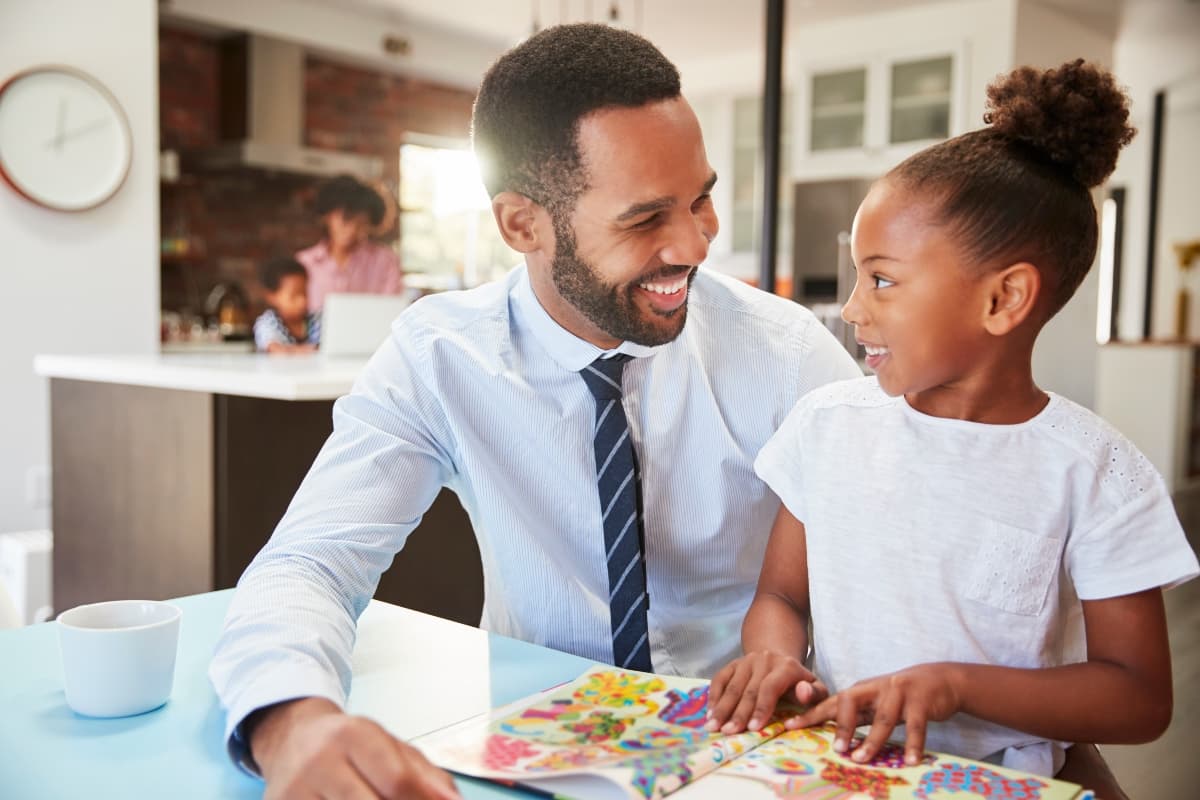 Father reading daughter