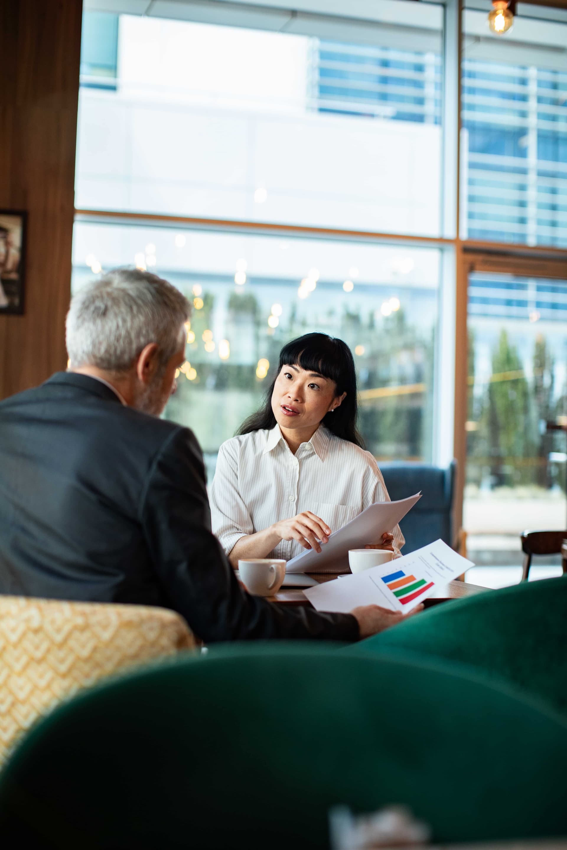 INT website image body woman and man discussing finances in cafe